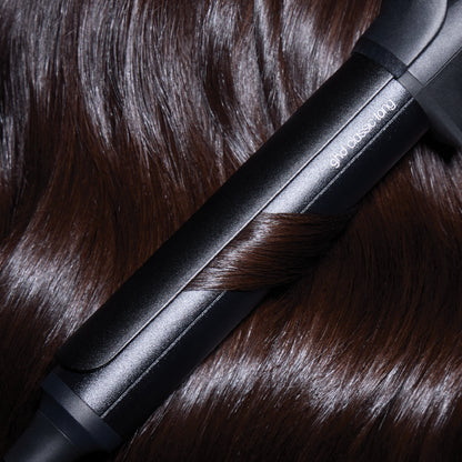 Black hair straightener on brown hair